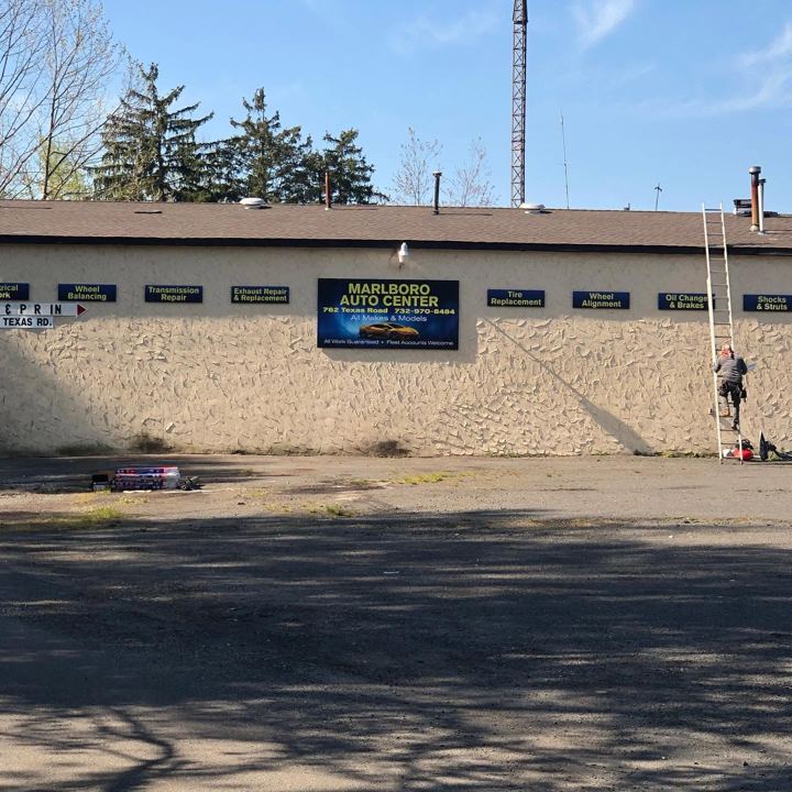 Shop exterior seen across the lot