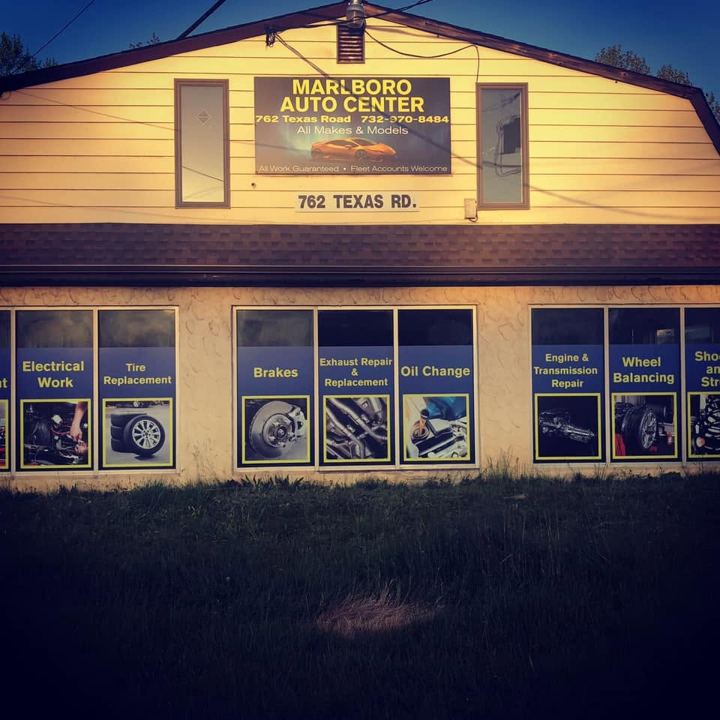 Marlboro Auto Center shop front at dusk