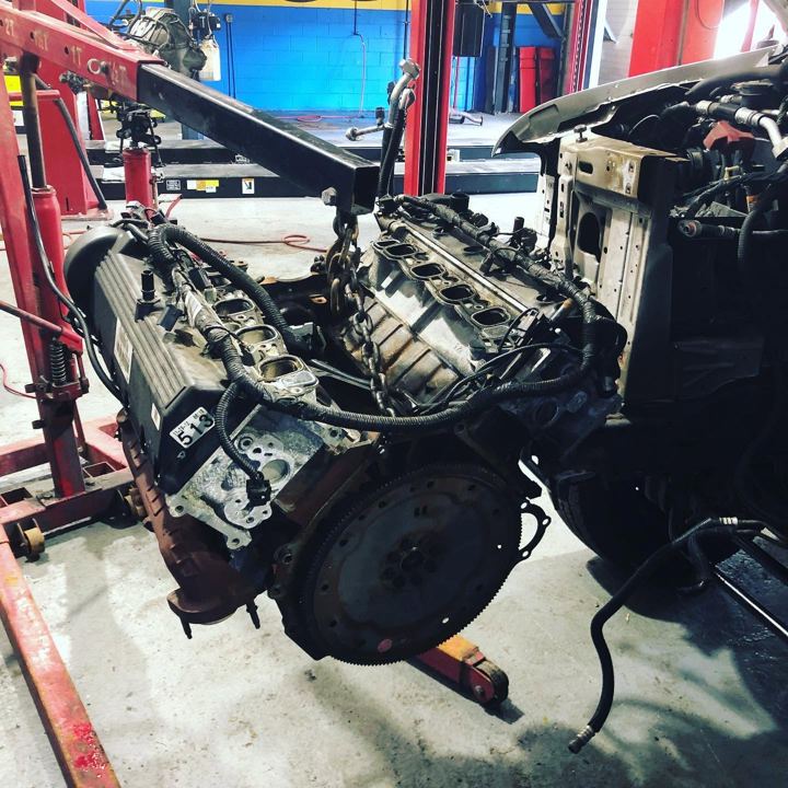 Engine removed from a vehicle on an engine hoist